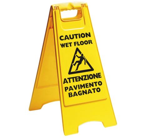 Cartello con avviso di pericolo pavimento bagnato